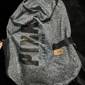 Pink bookbag and duffel bag